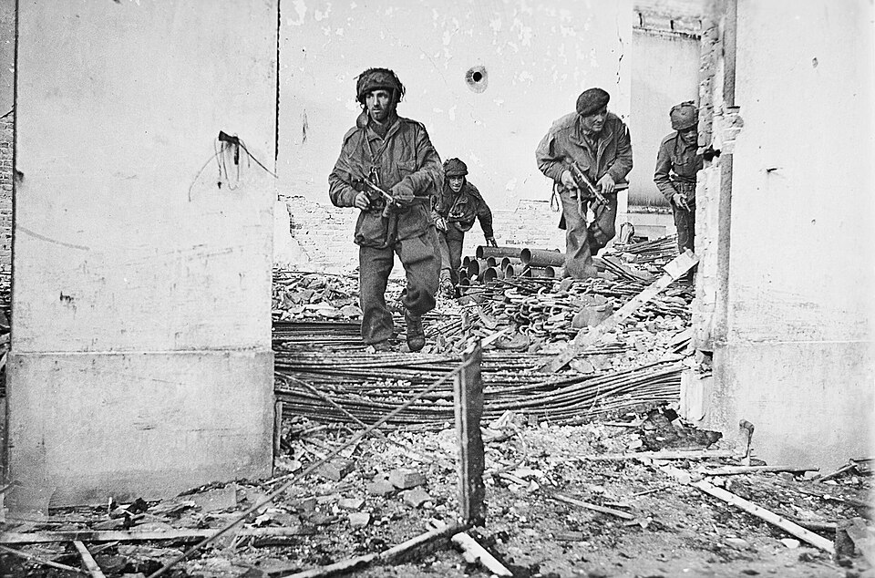 British paratroopers move through a damaged house in Oosterbeek, 23 September 1944. Photograph by Sergeant Dennis Smith, whose wartime account opens this article.