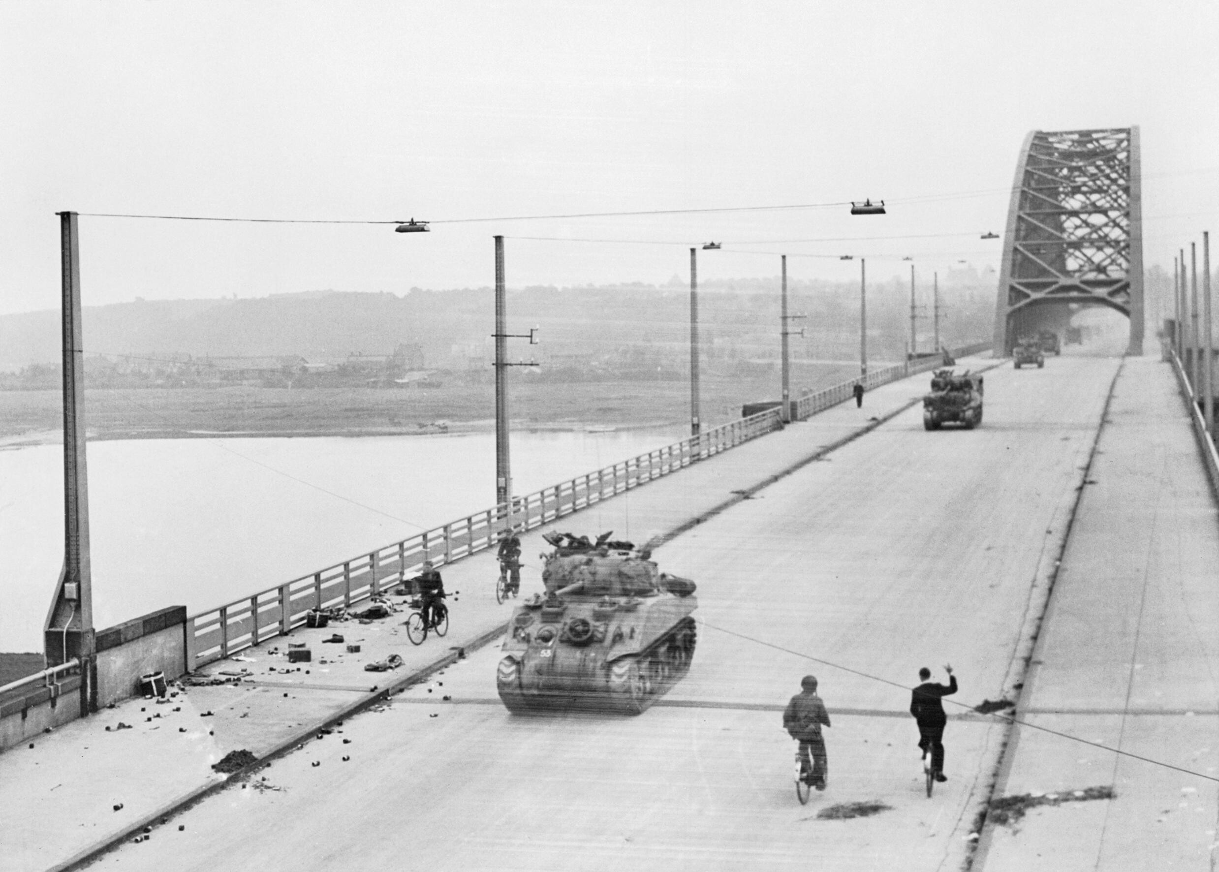 British XXX Corps armour crosses the road bridge at Nijmegen.