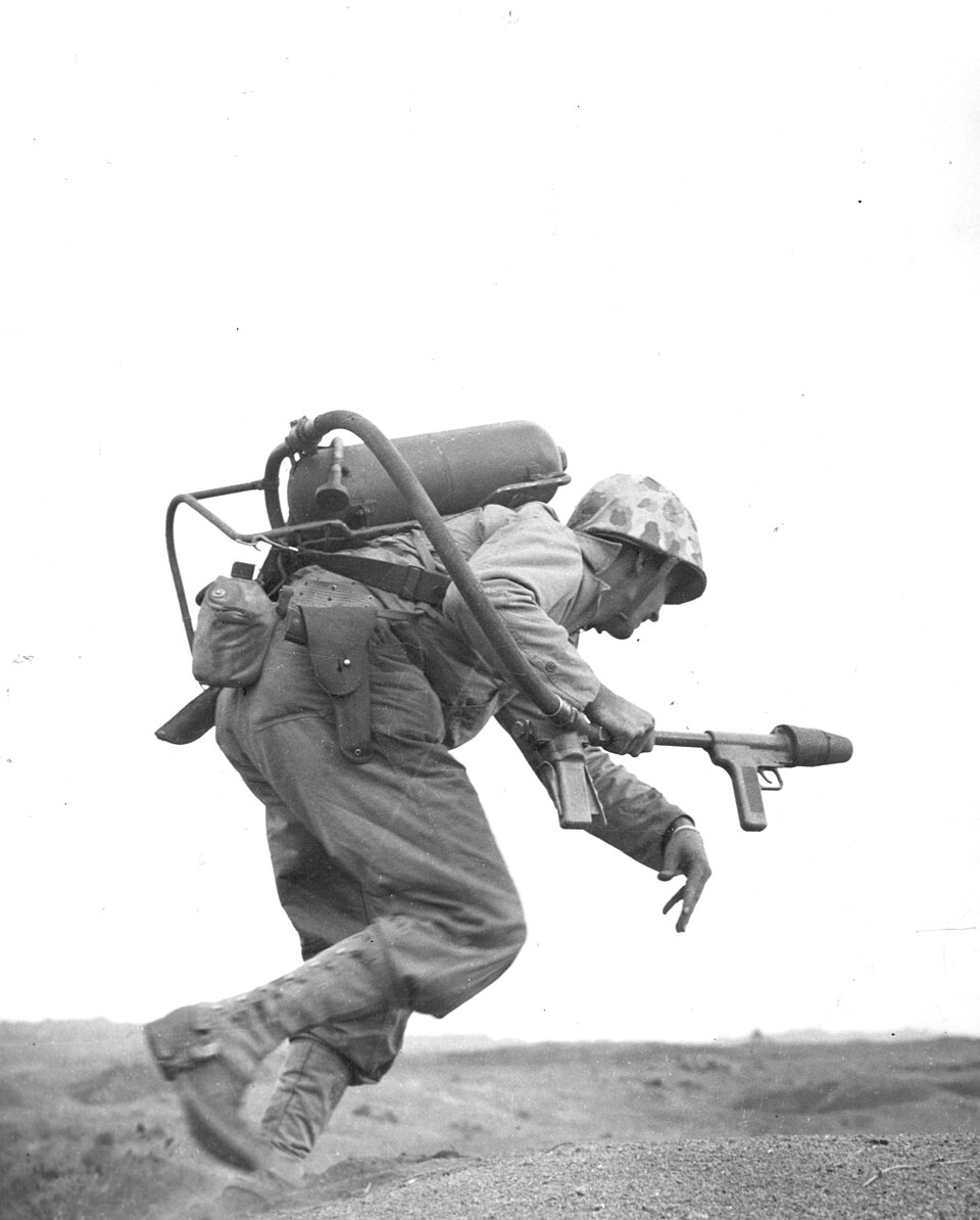 A flamethrower operator of E Company, 2nd Battalion, 9th Marines, under fire in February 1945. This is not identified as Woody Williams, who served with the 21st Marines.