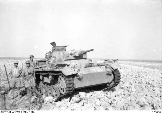 Australian officers beside a destroyed German Panzer III at Tobruk