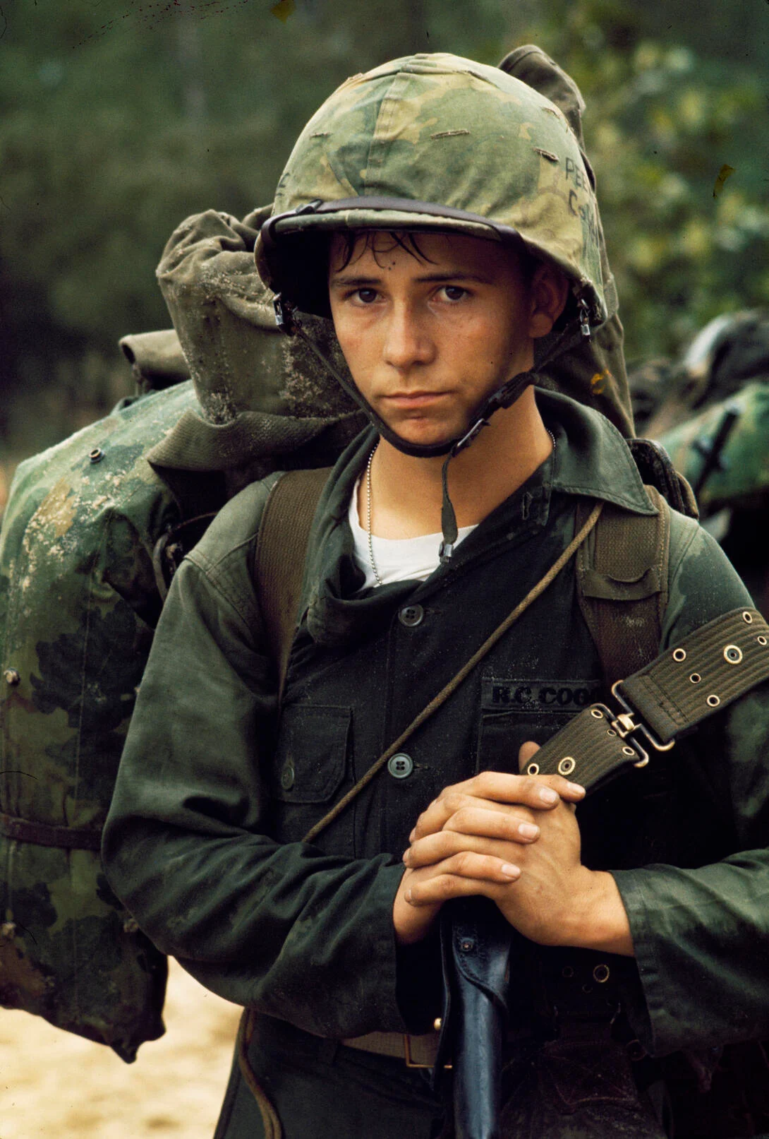A Marine waiting on the beach at Da Nang with his rifle