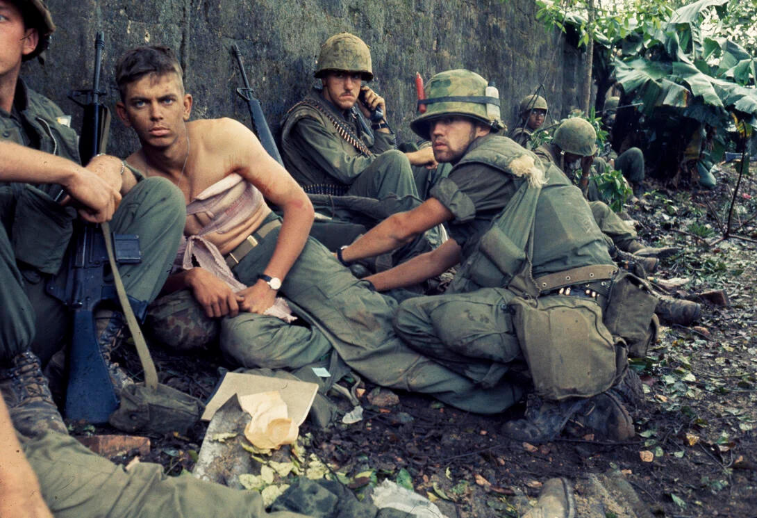 Navy corpsman D. R. Howe treating a wounded Marine at Huế