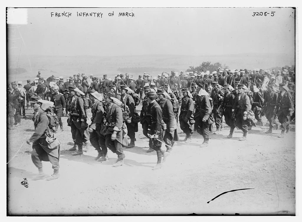 French infantry marching with rifles, packs and rolled equipment