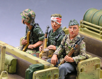King & Country WS054 Three Seated Riflemen. Set reference photograph from the Operation ToyBox media library; image © King & Country. The WS052 halftrack shown around the figures is a separate release.