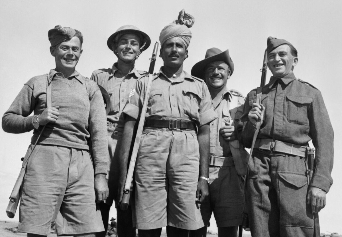 Allied soldiers at Tobruk, representing Polish, British, Indian, Australian and Czechoslovak forces. Wartime group photograph; public domain via Wikimedia Commons.